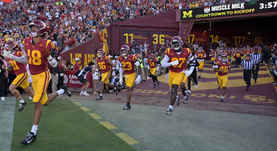 USC Trojans run out of the tunnel and on to the field for the game against the Michigan Wolverines at United Airlines Field at the Los Angeles Memorial Coliseum
