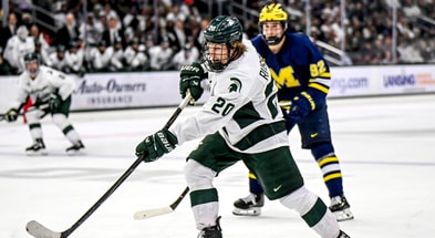 Michigan State's Daniel Russell shoots the puck against Michigan during the third period on Friday, Dec. 5, 2025, at Munn Ice Arena in East Lansing. - Nick King, USA TODAY Sports