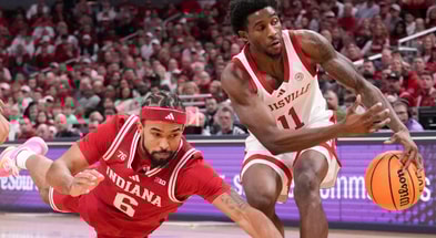 Louisville Cardinals guard Kobe Rodgers (11) gains control of the ball from Indiana Hoosiers guard Tayton Conerway (6) during a game Saturday, Dec. 6, 2025, at Gainbridge Fieldhouse in Indianapolis.