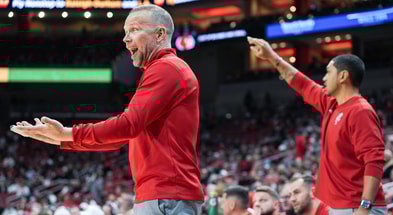 Louisville Cardinals head coach Pat Kelsey, left, yells from the sidelines as the Cards take on Eastern Michigan Nov. 24, 2025 at the KFC Yum! Center in Louisville, Kentucky. At right is assistant coach Peyton Siva, former star player at UofL.