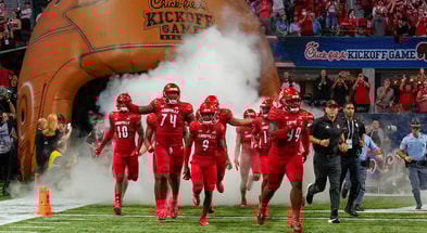 Sep 6, 2021; Atlanta, Georgia, USA; The Louisville Cardinals run out of the tunnel on to the field to take on the Mississippi Rebels at Mercedes-Benz Stadium. Mandatory Credit: Dale Zanine-Imagn Images