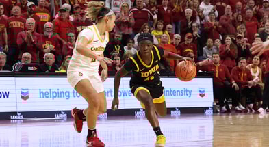 Chit-Chat Wright drives to the basket against an Iowa State defender. (Photo by Reese Strickland-Imagn Images)