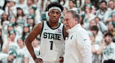 Michigan State guard Jeremy Fears Jr. talks to head coach Tom Izzo during the first half against Duke at Breslin Center in East Lansing on Saturday, Dec. 6, 2025. - Junfu Han, USA TODAY Sports