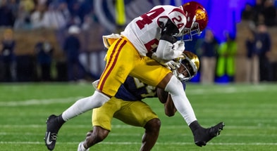 USC Trojans safety Christian Pierce (24) hits Notre Dame Fighting Irish running back Jadarian Price (24) during the second half at Notre Dame Stadium