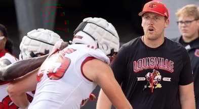 University of Louisville tight ends coach Ryan Wallace runs a drill during their second practice on Friday, Aug. 2, 2024 at L&N Federal Credit Union Stadium.