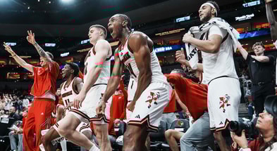 Louisville Cardinals bench erupts in cheers as teammate Cole Sherman hits a late three-point shot against Eastern Michigan as the Cards roll 87-46 to improve to 6-0 Monday night, Nov. 24, 2025 at the KFC Yum! Center in Louisville, Kentucky.