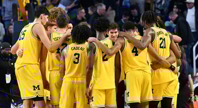 Michigan basketball tunnel photo huddle
