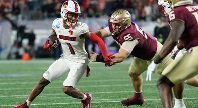 Dec 2, 2023; Charlotte, NC, USA; Louisville Cardinals wide receiver Jamari Thrash (1) runs after a catch as Florida State Seminoles defensive lineman Braden Fiske (55) defends during the third quarter at Bank of America Stadium. Mandatory Credit: Jim Dedmon-Imagn Images