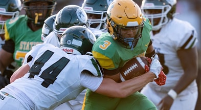 Trinity's Nick Lococo (44) tackles Bryan Station's Jordan Haskins (3) during their game on Friday, Aug. 23, 2024 at Bryan Station High School in Lexington, Ky.