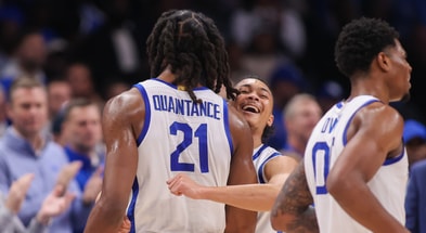 Dec 20, 2025; Atlanta, Georgia, USA; Kentucky Wildcats forward Jayden Quaintance (21) reacts with St. John Red Storm guard Jaland Lowe (15) in the second half at State Farm Arena. Mandatory Credit: Brett Davis-Imagn Images