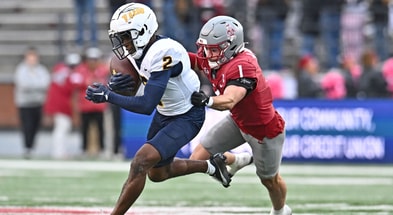 Oct 25, 2025; Pullman, Washington, USA; Toledo Rockets wide receiver Junior Vandeross III (2) makes a catch against Washington State Cougars safety Tucker Large (1) in the second half at Gesa Field at Martin Stadium. Mandatory Credit: James Snook-Imagn Images