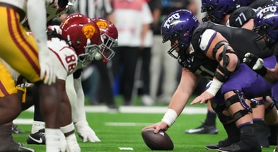 Helmets at the line of scrimmage as TCU Horned Frogs offensive lineman Coltin Deery (51) snaps the ball against the USC Trojans in the second half during the Alamo Bowl at Alamodome