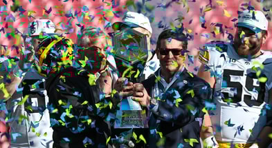 The Hawkeyes celebrate a ReliaQuest Bowl win over Vanderbilt. (Photo by Dennis Scheidt)