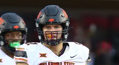 Oct 25, 2025; Lubbock, Texas, USA; Oklahoma State Cowboys offensive lineman Austin Kawecki (51) waits to snap the ball against the Texas Tech Red Raiders in the second half at Jones AT&T Stadium. Mandatory Credit: Michael C. Johnson-Imagn Images