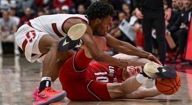 Jan 2, 2025; Stanford, California, USA; Stanford Cardinal guard Ebuka Okorie (1) and Louisville Cardinals guard Isaac McKneely (10) fight for a loose ball during the first half at Maples Pavilion. Mandatory Credit: Justine Willard-Imagn Images