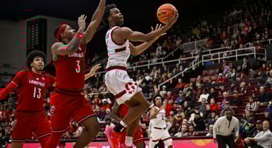 Jan 2, 2025; Stanford, California, USA; Stanford Cardinal guard Ebuka Okorie (1) goes for a layup against Louisville Cardinals guard Ryan Conwell (3) during the second half at Maples Pavilion. Mandatory Credit: Justine Willard-Imagn Images