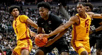 Michigan State's Cam Ward, center, battles USC's Jacob Cofie, left, and Jacob Cofie for a rebound during the first half on Monday, Jan. 5, 2026, at the Breslin Center in East Lansing. - Nick King, USA TODAY Sports