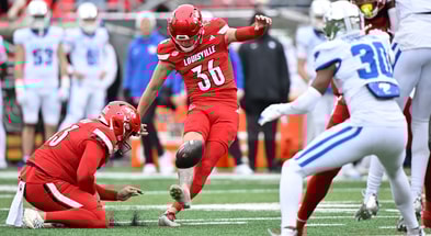 Nov 29, 2025; Louisville, Kentucky, USA; Louisville Cardinals kicker Cooper Ranvier (36) attempts a kick against the Louisville Cardinals during the first half at L&N Federal Credit Union Stadium. Louisville defeated Kentucky 41-0. Mandatory Credit: Jamie Rhodes-Imagn Images