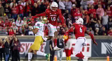 Louisville's Ben Perry (10) jumped to break up a pass during first half action as the Louisville Cardinals battled the Notre Dame Fighting Irish on Saturday, Oct. 7, 2023.