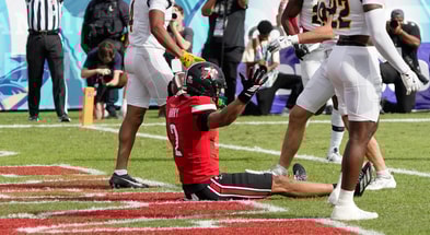 Dec 23, 2025; Boca Raton, FL, USA;Louisville Cardinals wide receiver Treyshun Hurry (2) celebrates a touchdown reception against the Toledo Rockets in the first quarter at Flagler CU Stadium. Mandatory Credit: Jeff Romance-Imagn Images
