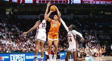 Raven Johnson and Agot Makeer guard Madison Booker (Photo by Katie Dugan/GamecockCentral)