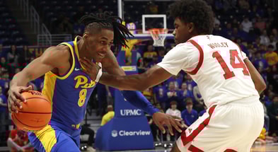 Jan 17, 2026; Pittsburgh, Pennsylvania, USA; Pittsburgh Panthers guard Omari Witherspoon (8) drives to the basket against Louisville Cardinals guard Adrian Wooley (14) during the first half at the Petersen Events Center. Mandatory Credit: Charles LeClaire-Imagn Images