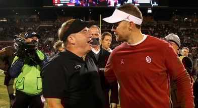 Oklahoma Sooners head coach Lincoln Riley (right) greets TCU Horned Frogs head coach Gary Patterson after the game at Gaylord Family - Oklahoma Memorial Stadium