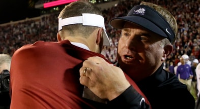 Oklahoma Sooners head coach Lincoln Riley (left) hugs TCU Horned Frogs head coach Gary Patterson after the game at Gaylord Family - Oklahoma Memorial Stadium