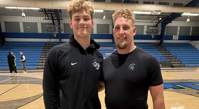 2027 OT Caleb Siler with Michigan State linebackers coach Max Bullough