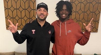 Lawrence Britt with Texas Tech WR's coach Juice Johnson