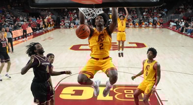 USC Trojans forward Ezra Ausar (2) dunks the ball against the Rutgers Scarlet Knights in the first half at Galen Center