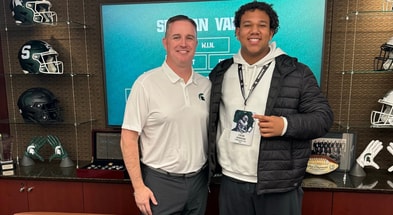 OT Caleb Johnson with Michigan State HC Pat Fitzgerald (photo via Johnson social media)