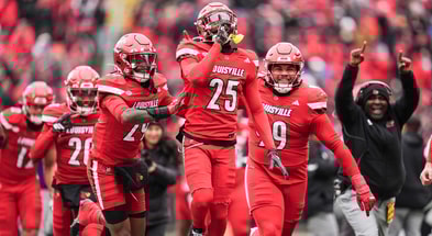 Louisville Cardinals defensive back Tayon Holloway (25) celebrates with his teammates after his interception against Kentucky in the second half Saturday, November 29, 2025 in Louisville, Kentucky at L&N Federal Credit Union Stadium. The Cards were rolling 27-0 through the fourth quarter.