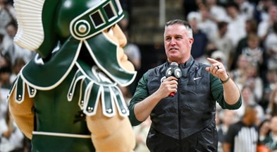 Michigan State's new football coach Pat Fitzgerald addresses the crowd during a timeout in the first half of the Spartans basketball game against Iowa on Tuesday, Dec. 2, 2025, at the Breslin Center. - Nick King, USA TODAY Sports