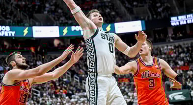 Michigan State's Jaxon Kohler, center, takes the ball between Illinois' Tomislav Ivisic, left, and Ben Humrichous during the second half on Saturday, Feb. 7, 2026, at the Breslin Center. - Nick King, USA TODAY Sports
