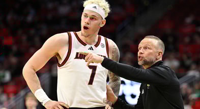 Feb 4, 2026; Louisville, Kentucky, USA; Louisville Cardinals head coach Pat Kelsey talks with forward Kasean Pryor (7) during the second half against the Notre Dame Fighting Irish at KFC Yum! Center. Louisville defeated Notre Dame 76-65. Mandatory Credit: Jamie Rhodes-Imagn Images
