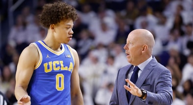 UCLA Bruins head coach Mick Cronin talks to guard Trent Perry (0) in the first half against the Michigan Wolverines at Crisler Center. - Rick Osentoski, USA TODAY Sports