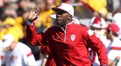 Oct 11, 2014; Iowa City, IA, USA; Indiana Hoosiers runnings back coach Deland McCullough signals in to his team during their game against the Iowa Hawkeyes at Kinnick Stadium. Iowa beat Indiana 45-29. Mandatory Credit: Reese Strickland-Imagn Images