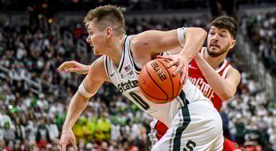 Michigan State's Jaxon Kohler, left, moves around Ohio State's Ivan Niegovan on his way to a score during the second half on Sunday, Feb. 22, 2026, at the Breslin Center in East Lansing. - Nick King, USA TODAY Sports