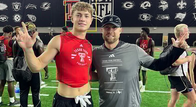 Hunter Haug with Texas Tech safeties coach Rob Greene