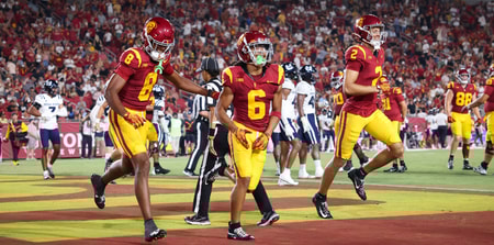 USC Trojans wide receivers celebrate a touchdown by Makai Lemon