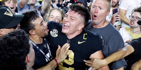 Vanderbilt Commodores quarterback Diego Pavia celebrates with fans after defeating the Alabama Crimson Tide at FirstBank Stadium. Mandatory Credit: Butch Dill-Imagn Images