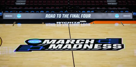 Mar 19, 2025; Wichita, KS, USA; The March Madness logo at midcourt at the Intrust Bank Arena. Mandatory Credit: Kirby Lee-Imagn Images