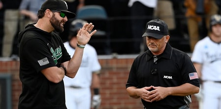 Wright State baseball coach Alex Sogard talks to an umpire vs. Vanderbilt