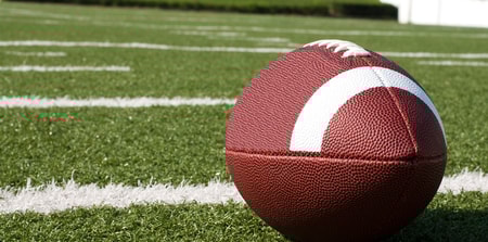 Closeup of American Football on Field
