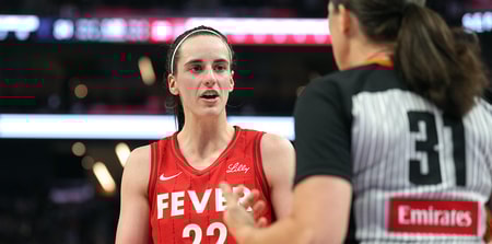 Indiana Fever guard Caitlin Clark talks with a refere