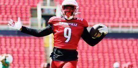 Louisville football's Antonio Watts (9) celebrates with the football during Louisville's first scrimmage on 8/9/2025