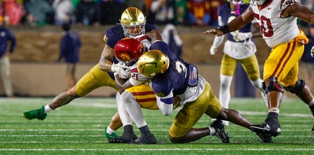 Notre Dame defenders Jaylen Sneed and Jordan Botelho USC