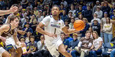 West Virginia guard Jasper Floyd drives against Lehigh