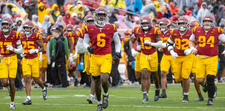 The USC Trojans take the field against the Iowa Hawkeyes
